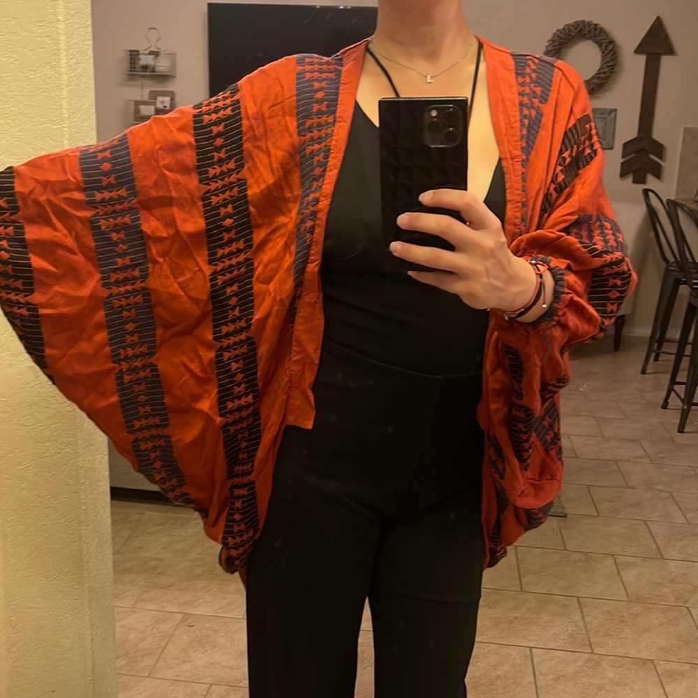 Orange and black poncho